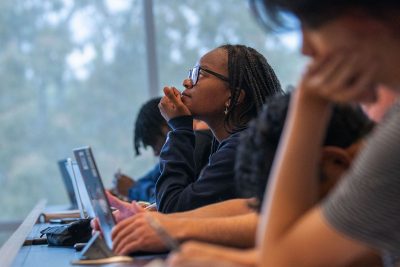 Students sit in a classroom.